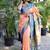 Peach paithani silk blend saree with contrast border & zari floral weaving