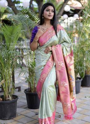 Pastel mint green paithani silk blend saree with contrast border & zari floral weaving 1