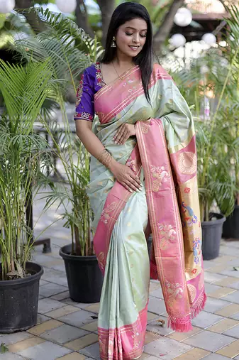Pastel mint green paithani silk blend saree with contrast border & zari floral weaving