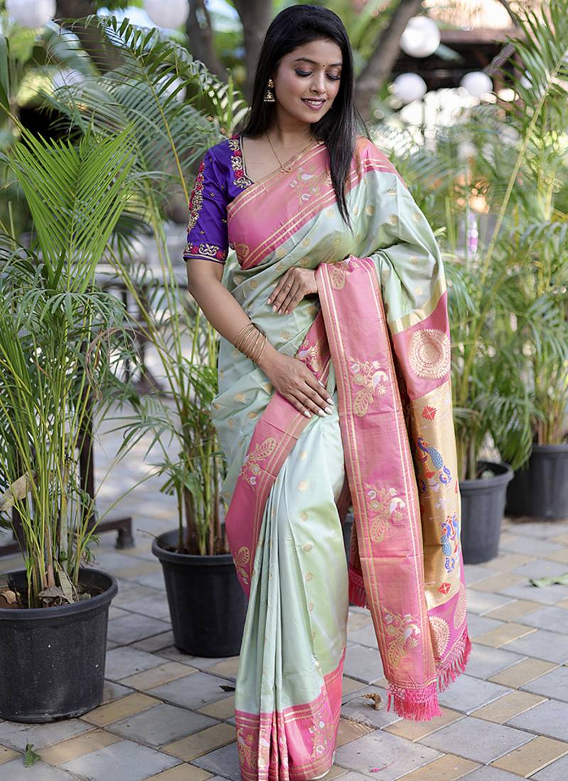 Pastel mint green paithani silk blend saree with contrast border & zari floral weaving