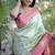 Pastel mint green paithani silk blend saree with contrast border & zari floral weaving