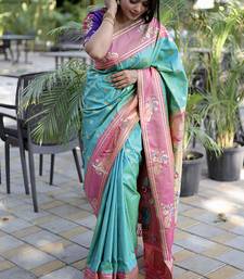 Aqua blue paithani silk blend saree with contrast border & zari floral weaving