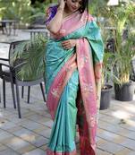 Aqua blue paithani silk blend saree with contrast border & zari floral weaving