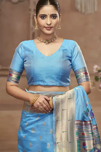 Sky blue paithani silk blend saree with gold zari border & peacock pallu