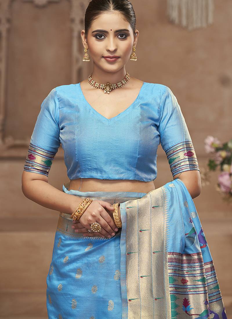 Sky blue paithani silk blend saree with gold zari border & peacock pallu