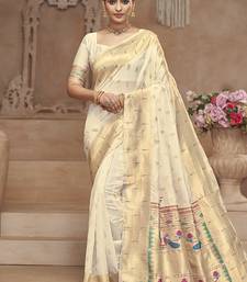 Off white paithani silk blend saree with gold zari border & peacock pallu