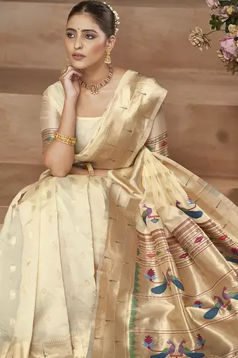 Off white paithani silk blend saree with gold zari border & peacock pallu