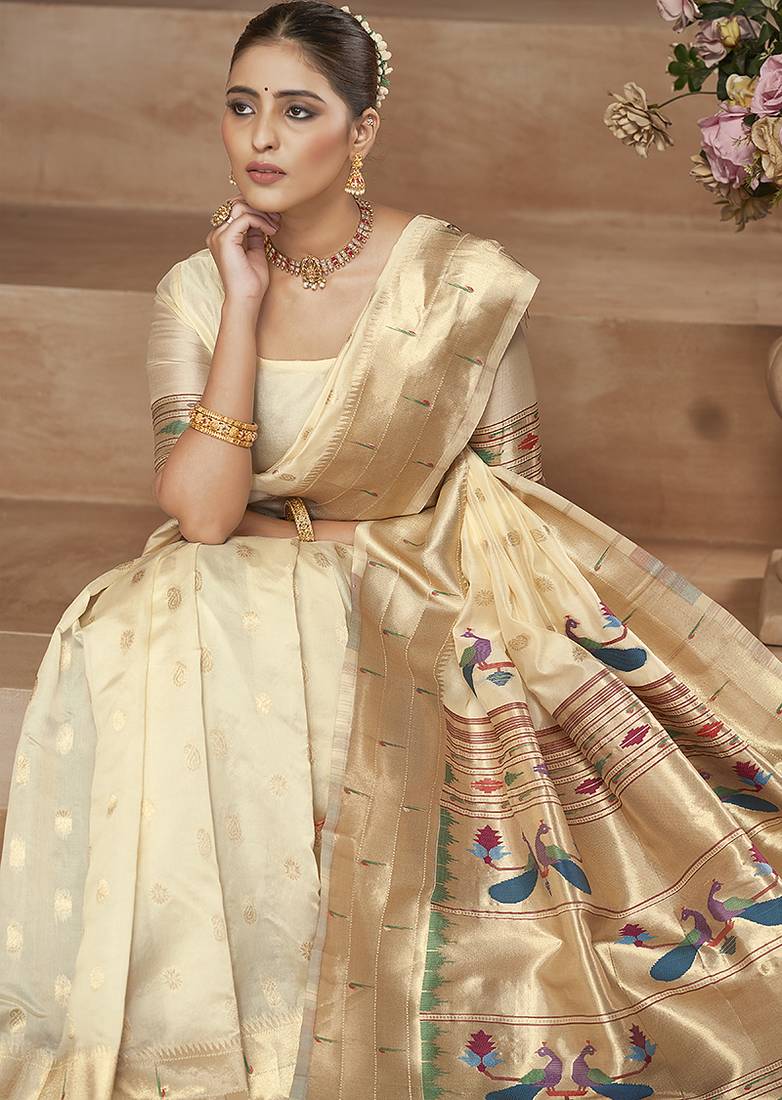 Off white paithani silk blend saree with gold zari border & peacock pallu