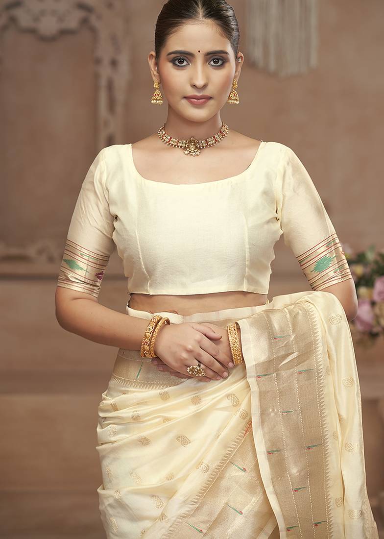 Off white paithani silk blend saree with gold zari border & peacock pallu