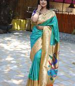 Aqua blue silk blend paithani saree with peacock pallu, golden zari border