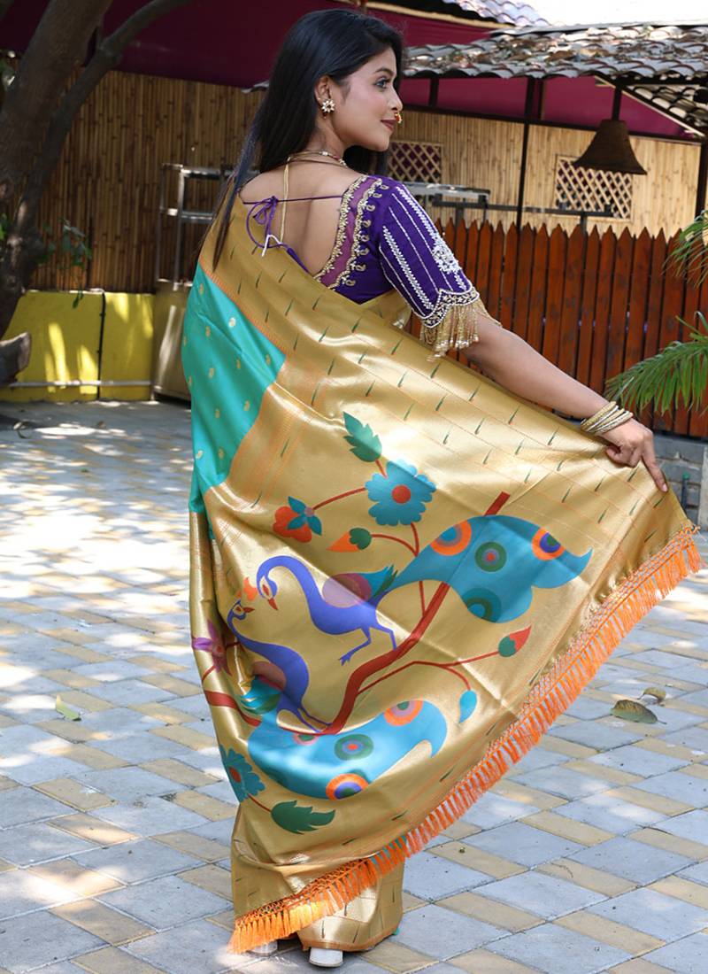Aqua blue silk blend paithani saree with peacock pallu, golden zari border