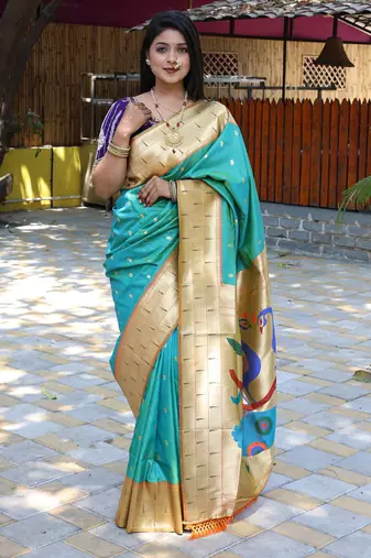 Aqua blue silk blend paithani saree with peacock pallu, golden zari border