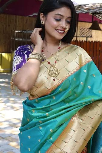 Aqua blue silk blend paithani saree with peacock pallu, golden zari border