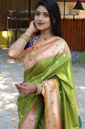 Parrot green silk blend paithani saree with peacock pallu, golden zari border