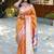 Orange silk blend paithani saree with peacock pallu, golden zari border