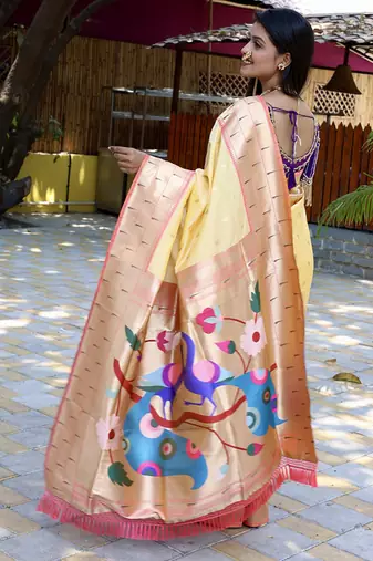 Orange silk blend paithani saree with peacock pallu, golden zari border