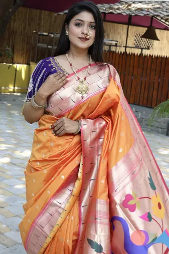 Orange silk blend paithani saree with peacock pallu, golden zari border