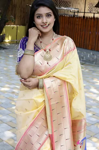 Cream silk blend paithani saree with peacock pallu, golden zari border