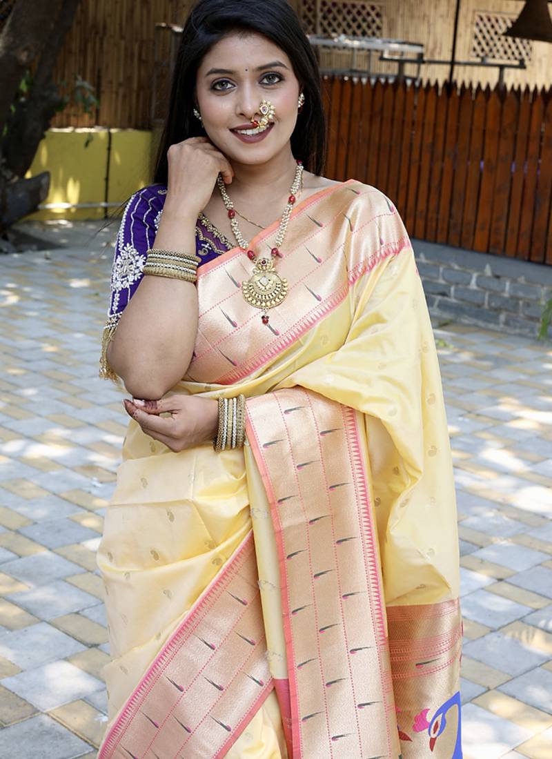 Cream silk blend paithani saree with peacock pallu, golden zari border