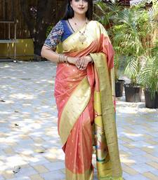 Salmon pink silk blend paithani saree with peacock pallu, golden zari border