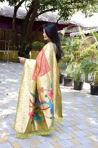 Salmon pink silk blend paithani saree with peacock pallu, golden zari border