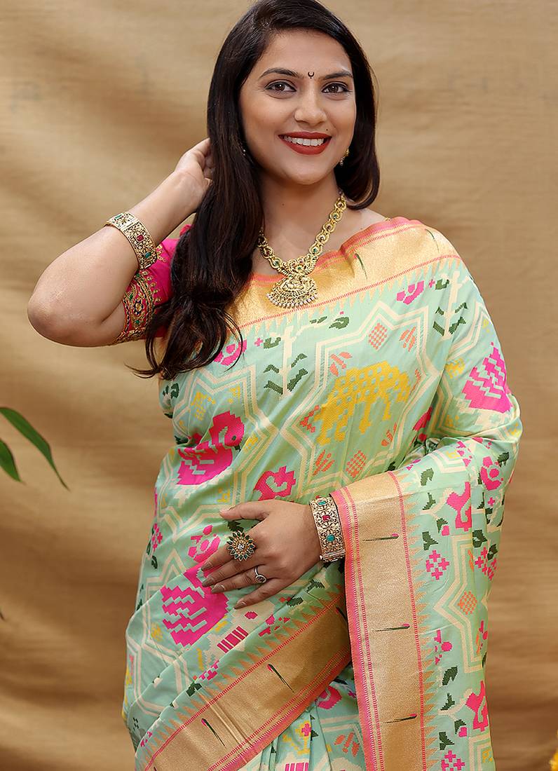 Mint green patola silk blend saree with bird motif paithani pallu and zari border