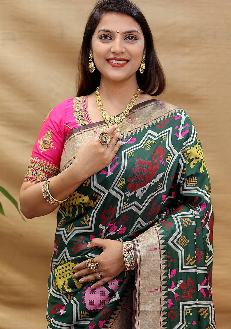 Dark green patola silk blend saree with bird motif paithani pallu and zari border