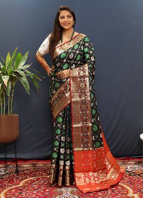 Black silk blend patola saree with zari border and contrast red pallu 1