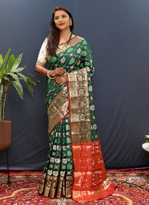 Dark green silk blend patola saree with zari border and contrast red pallu 2