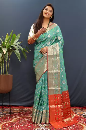 Turquoise silk blend patola saree with zari border and contrast red pallu