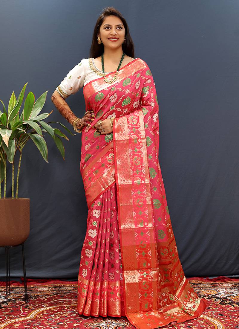 Rani pink silk blend patola saree with zari border and contrast red pallu