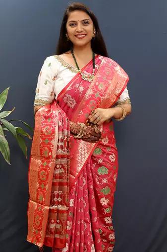 Rani pink silk blend patola saree with zari border and contrast red pallu