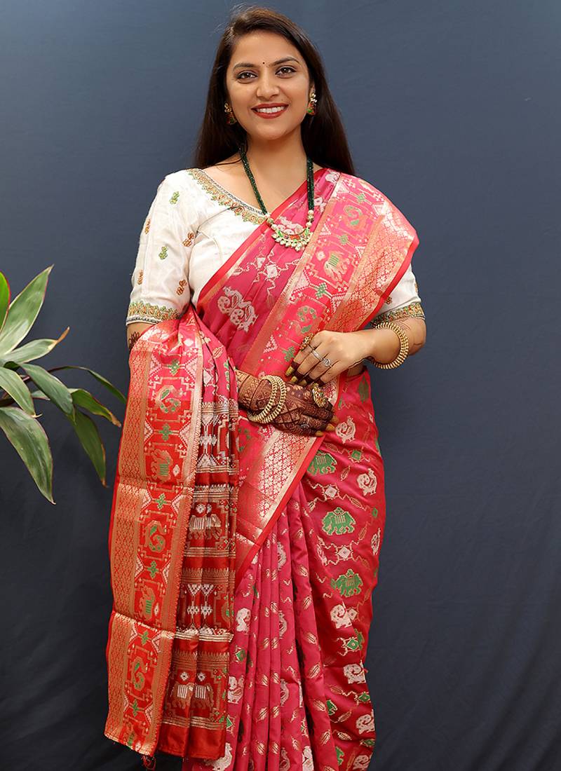 Rani pink silk blend patola saree with zari border and contrast red pallu