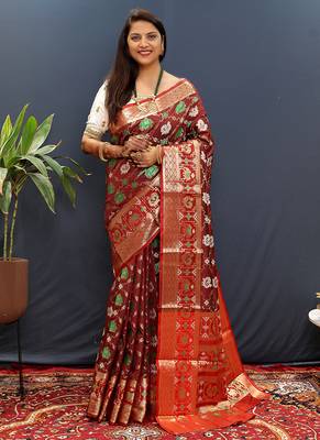 Maroon silk blend patola saree with zari border and contrast red pallu 1