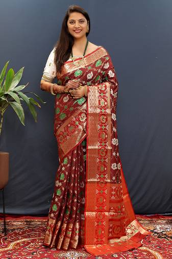 Maroon silk blend patola saree with zari border and contrast red pallu