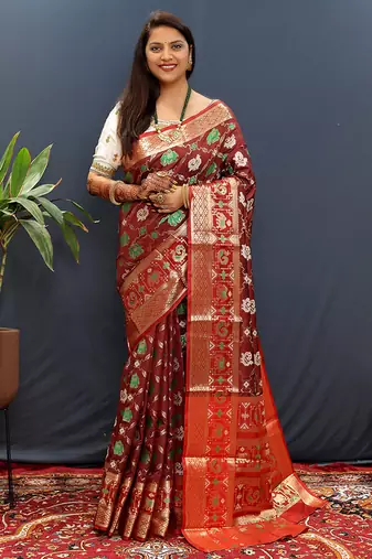 Maroon silk blend patola saree with zari border and contrast red pallu