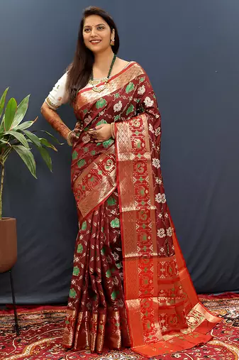 Maroon silk blend patola saree with zari border and contrast red pallu
