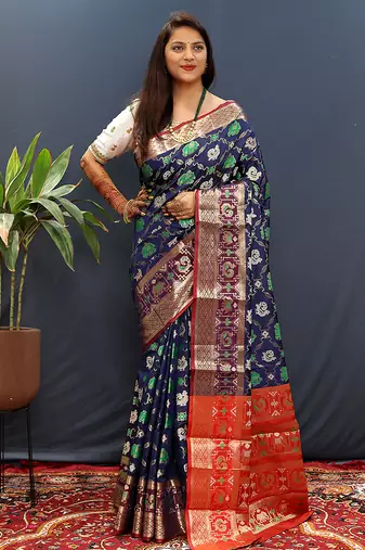 Navy blue silk blend patola saree with zari border and contrast red pallu