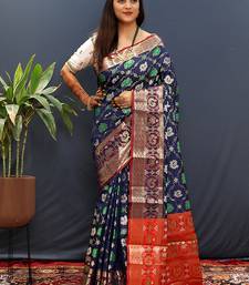 Navy blue silk blend patola saree with zari border and contrast red pallu