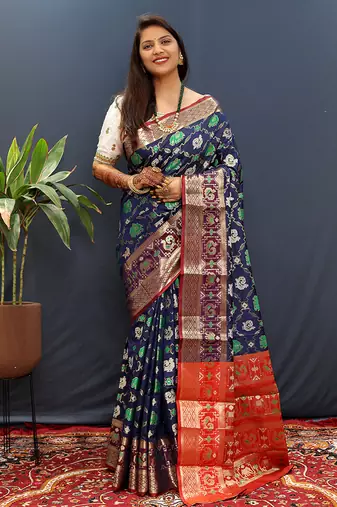 Navy blue silk blend patola saree with zari border and contrast red pallu