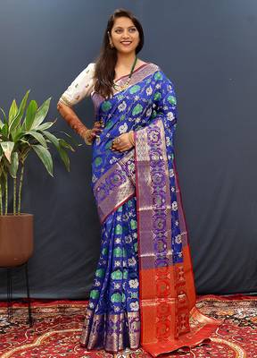 Royal blue silk blend patola saree with zari border and contrast red pallu 1