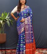 Royal blue silk blend patola saree with zari border and contrast red pallu