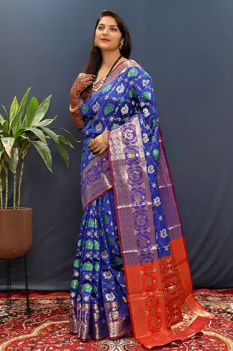 Royal blue silk blend patola saree with zari border and contrast red pallu