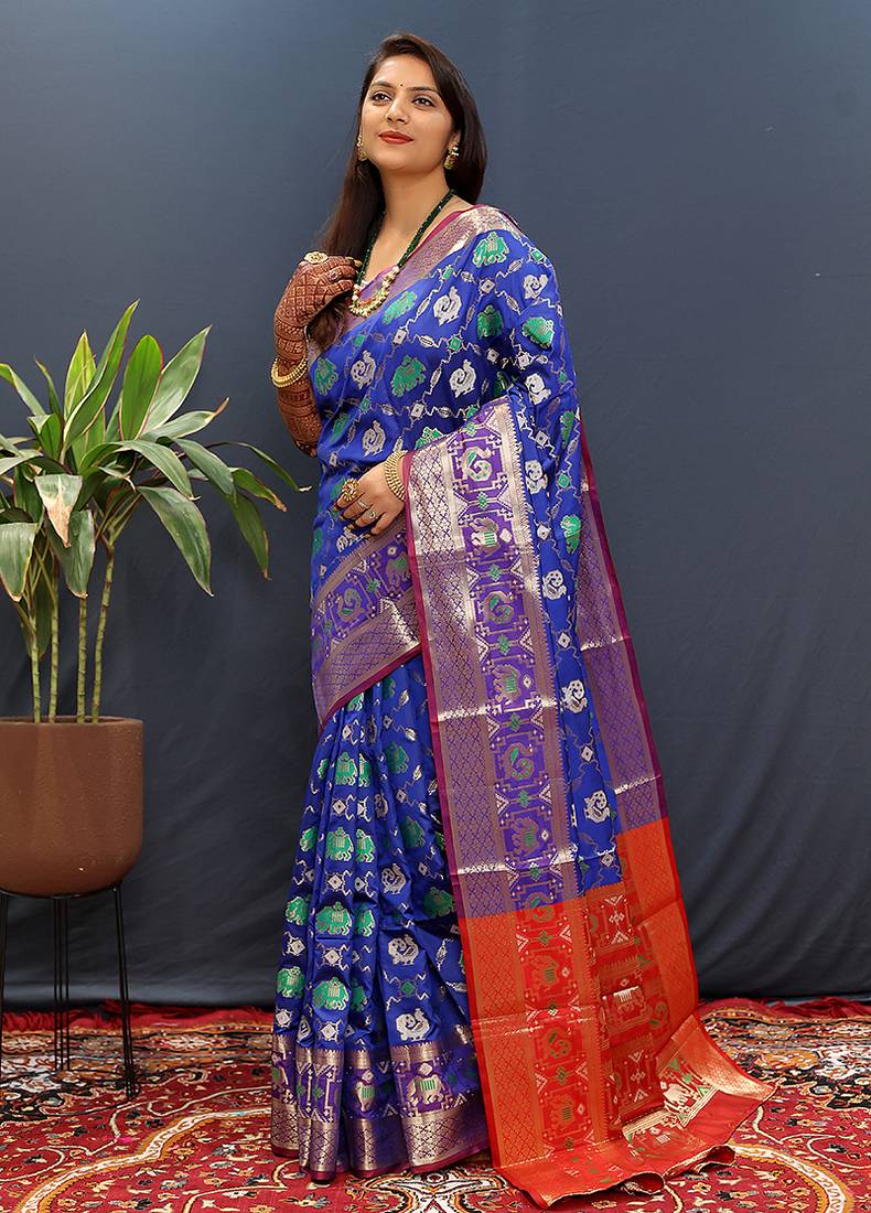 Royal blue silk blend patola saree with zari border and contrast red pallu