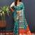 Teal blue silk blend patola saree with zari border and contrast red pallu