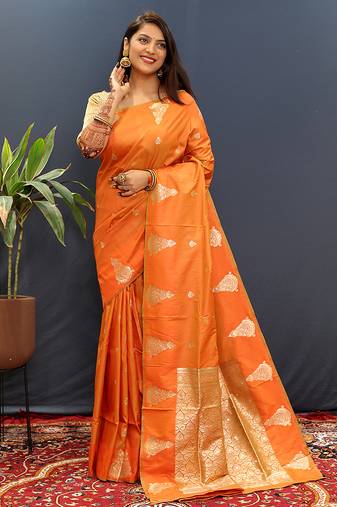 Orange silk blend banarasi saree with golden zari buti and border