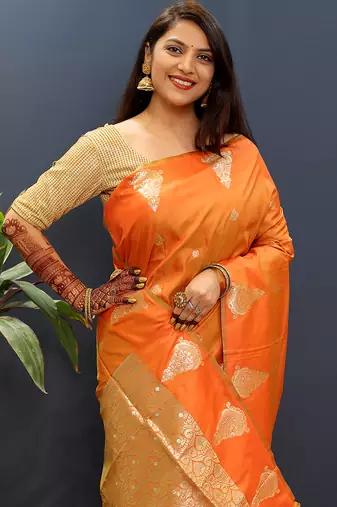 Orange silk blend banarasi saree with golden zari buti and border