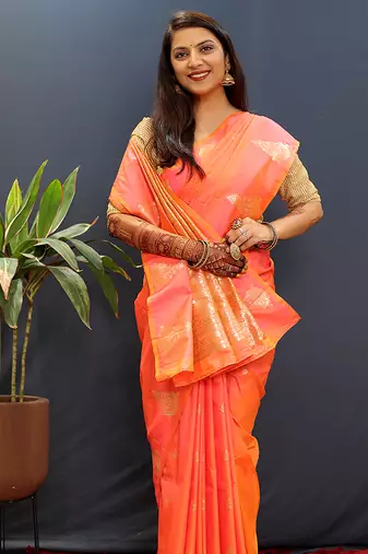 Peach silk blend banarasi saree with golden zari buti and border