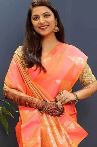 Peach silk blend banarasi saree with golden zari buti and border