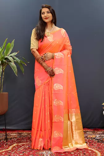 Peach silk blend banarasi saree with golden zari buti and border